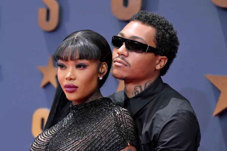 two artists posing together