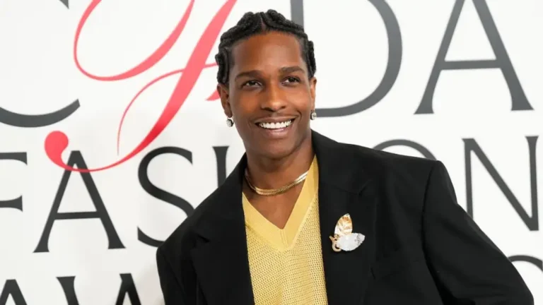 man standing against back drop