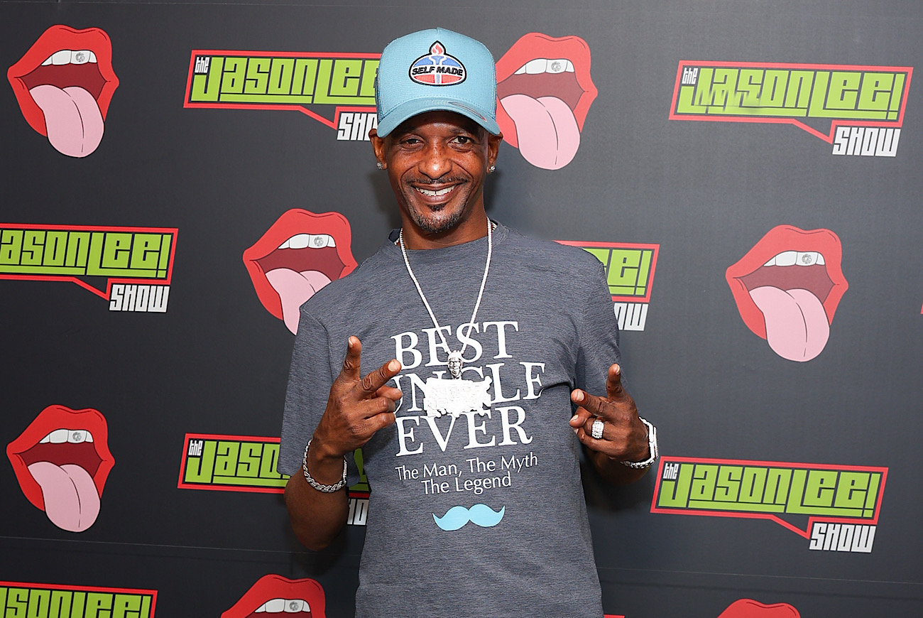 man posing on backdrop