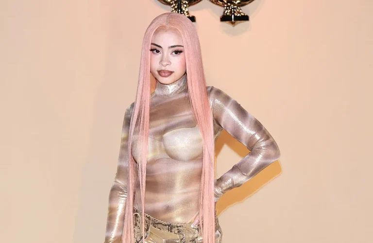 singer posing onback drop