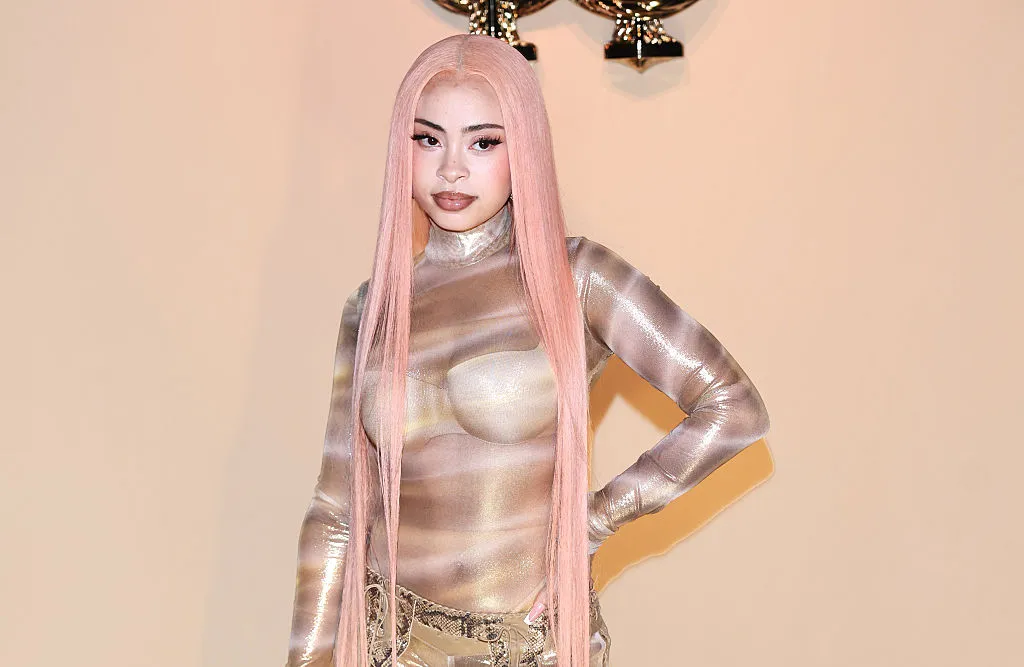 singer posing onback drop