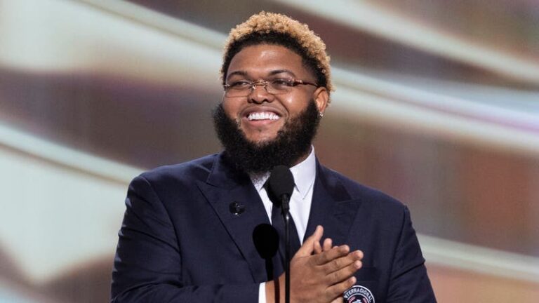 man smiling on stage